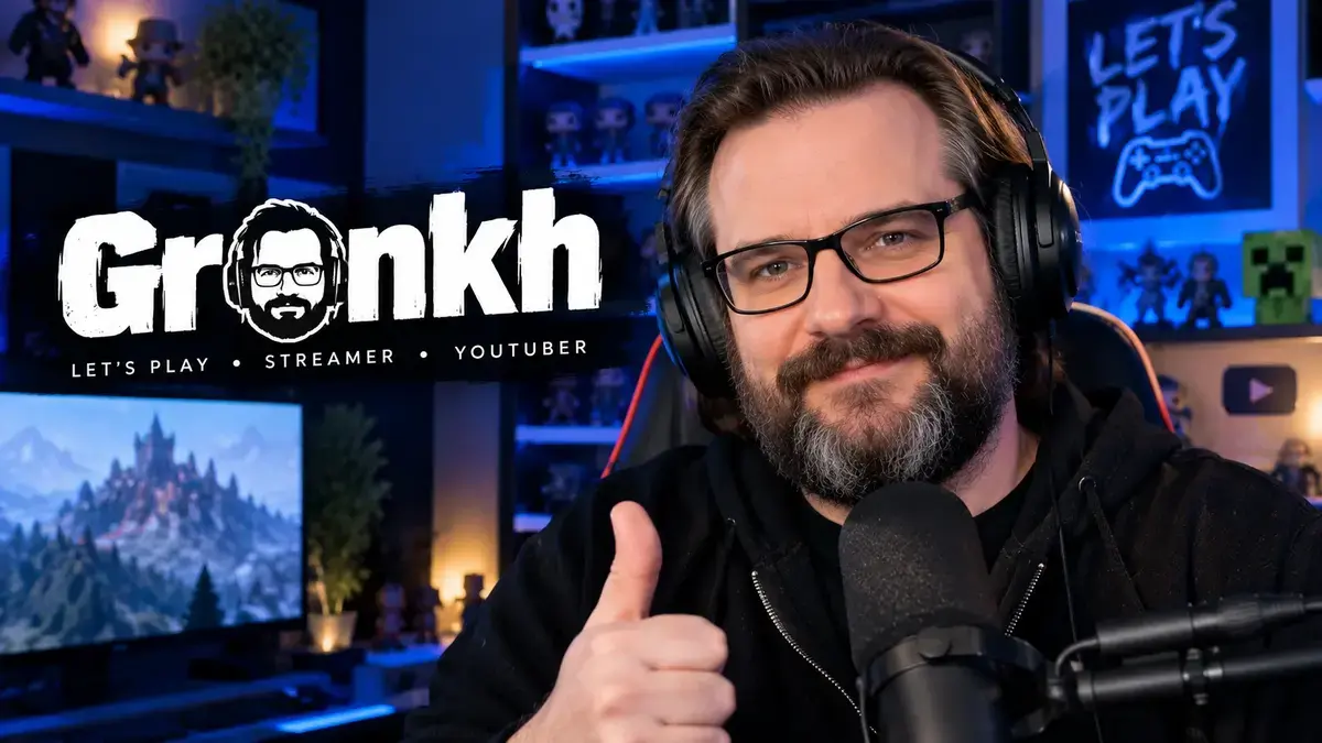 Gronkh wearing headphones and glasses in a blue-lit gaming studio