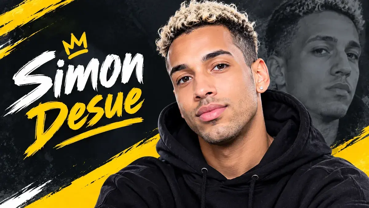 Simon Desue portrait in a black hoodie with yellow and white graphic lettering