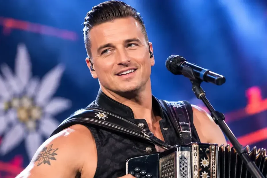 Andreas Gabalier performing live with an accordion on stage