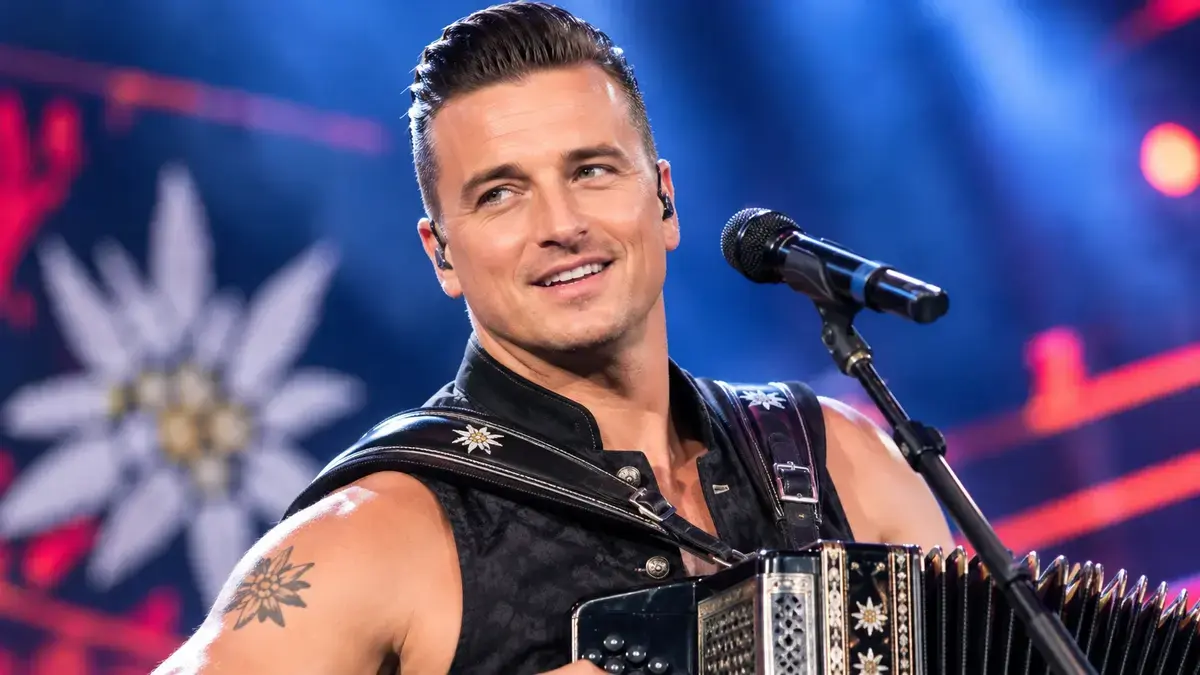Andreas Gabalier performing live with an accordion on stage